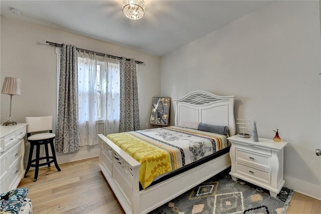 bedroom with light hardwood / wood-style flooring