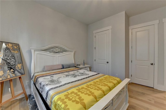 bedroom with light wood-type flooring