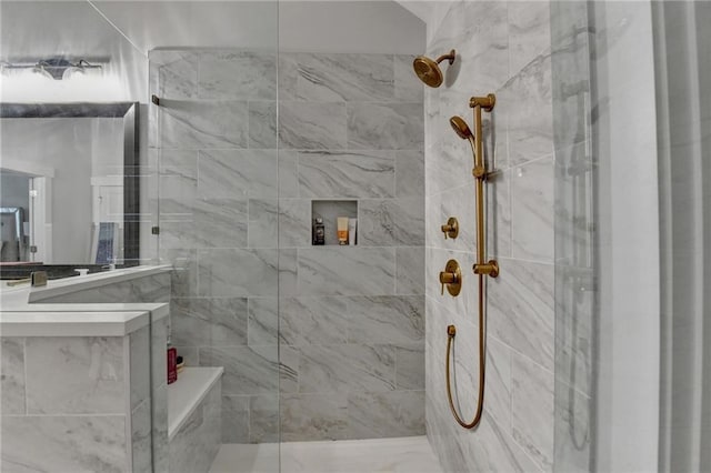 bathroom with a tile shower