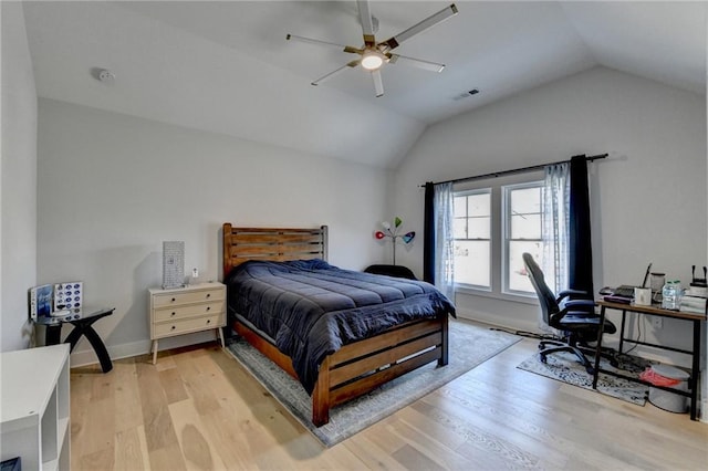 bedroom featuring lofted ceiling, ceiling fan, and light hardwood / wood-style flooring