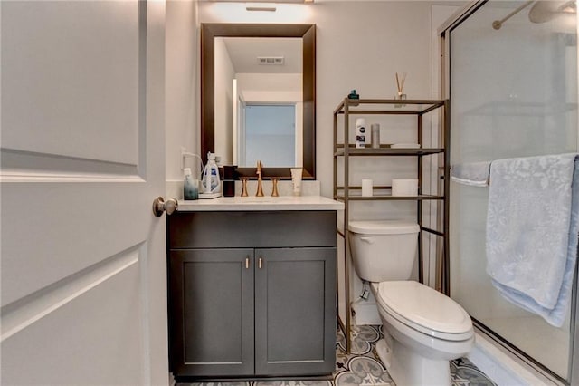 bathroom with walk in shower, vanity, and toilet