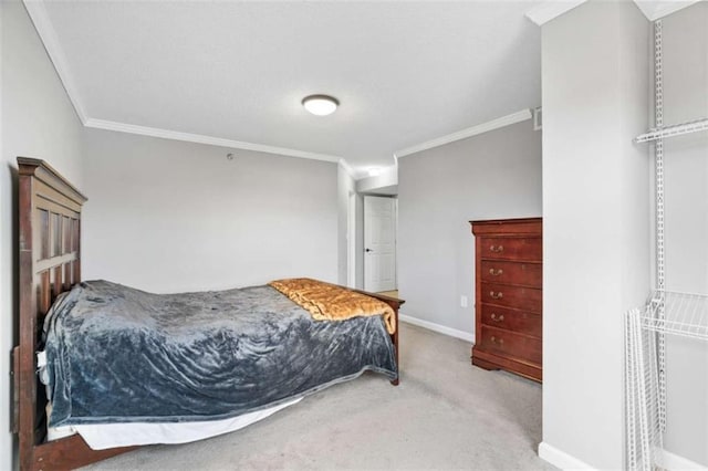 bedroom featuring carpet floors, baseboards, and ornamental molding