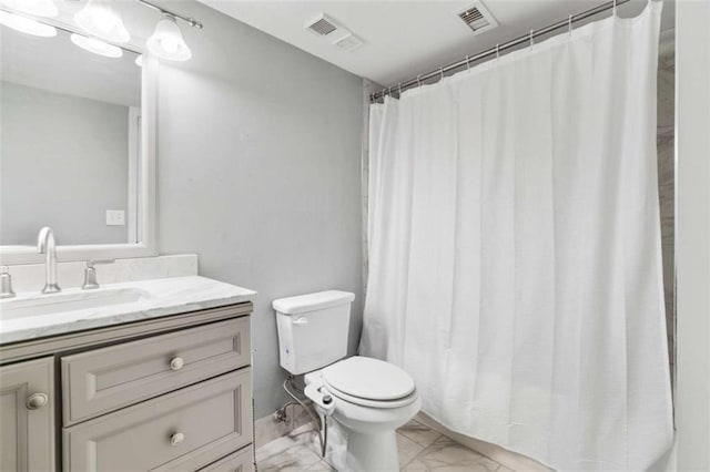 bathroom featuring toilet, marble finish floor, vanity, and visible vents