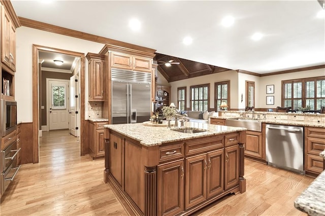 13037 Overlook Pass, Roswell, GA 30075 - kitchen with appliances with stainless steel finishes, light wood-style floors, an island with sink, crown molding, and a ceiling fan