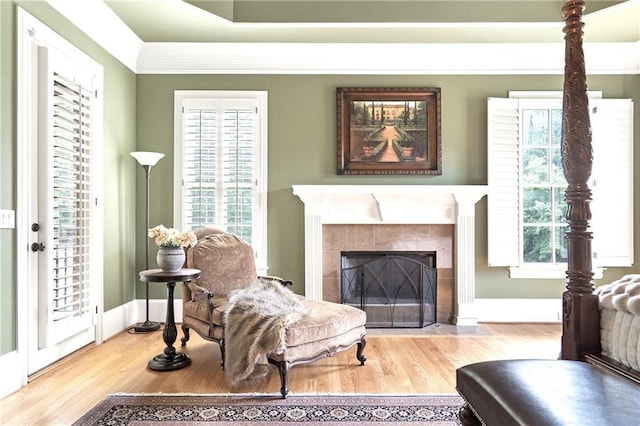 13037 Overlook Pass, Roswell, GA 30075 - living room with wood finished floors, a tile fireplace, and crown molding