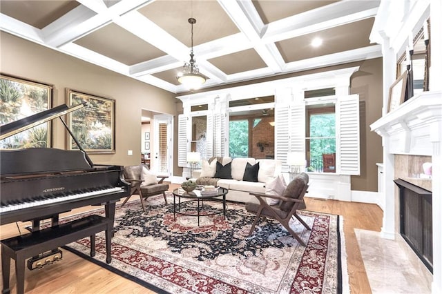 13037 Overlook Pass, Roswell, GA 30075 - living room with a high end fireplace, coffered ceiling, light wood-style flooring, beam ceiling, and a chandelier