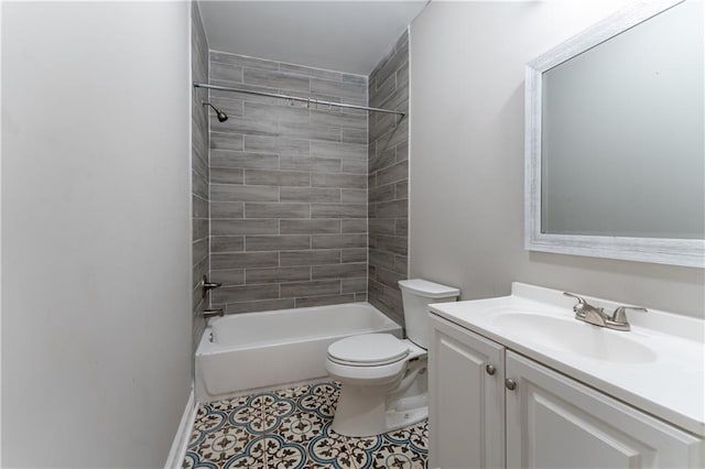 full bathroom with tiled shower / bath combo, vanity, tile patterned floors, and toilet