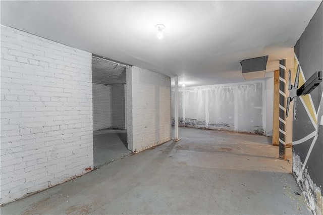 basement with brick wall