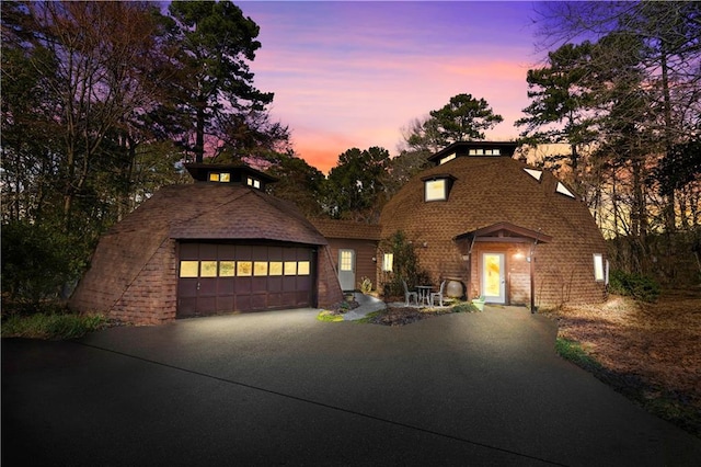 view of front of property featuring a garage and driveway