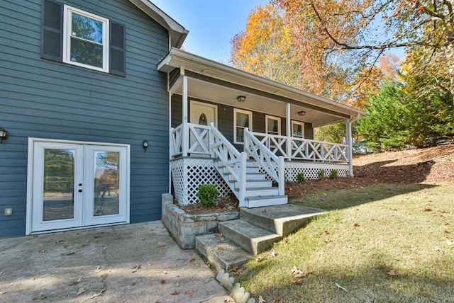 property entrance featuring a porch and french doors