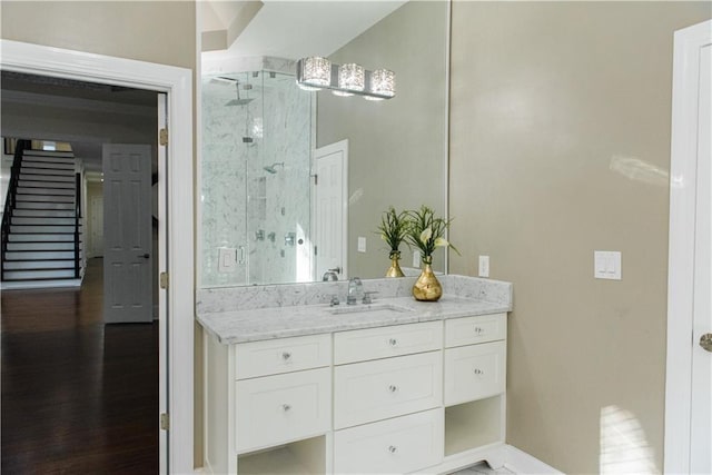3258 Bransley Way, Duluth, GA 30097 - bathroom featuring vanity, a stall shower, and wood finished floors