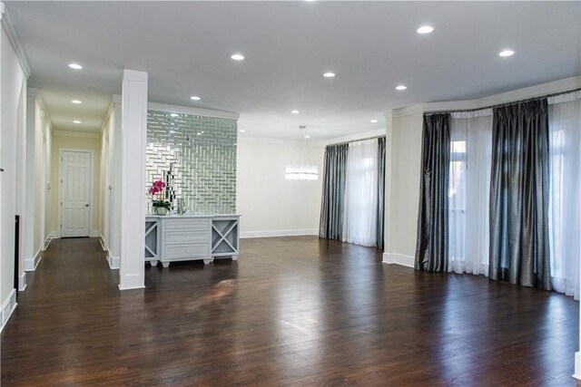 3258 Bransley Way, Duluth, GA 30097 - living area with ornamental molding, dark wood finished floors, a chandelier, and recessed lighting