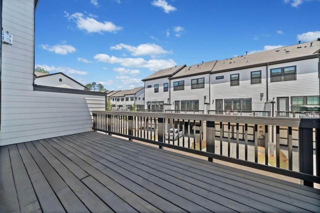 wooden terrace featuring a residential view