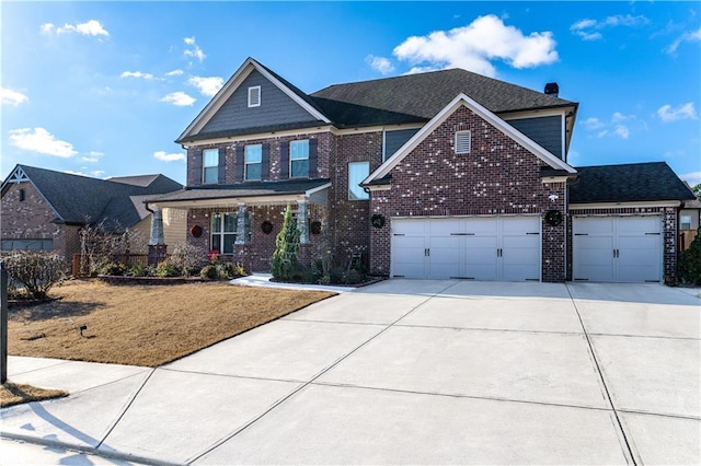 view of front of house featuring a front lawn and a garage