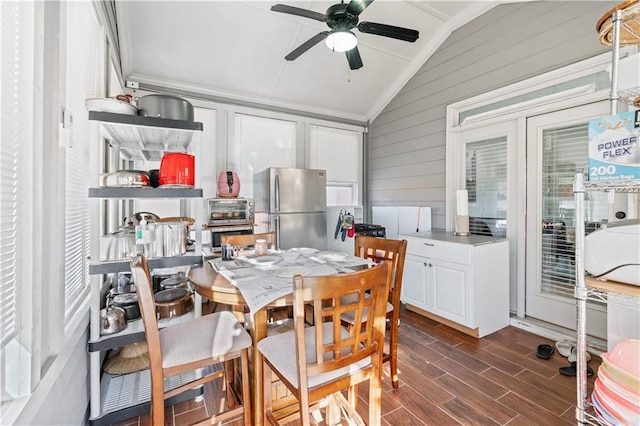 interior space with ceiling fan and lofted ceiling