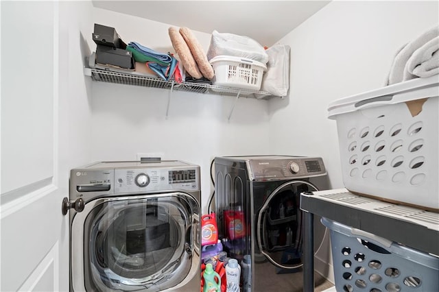 laundry room with separate washer and dryer