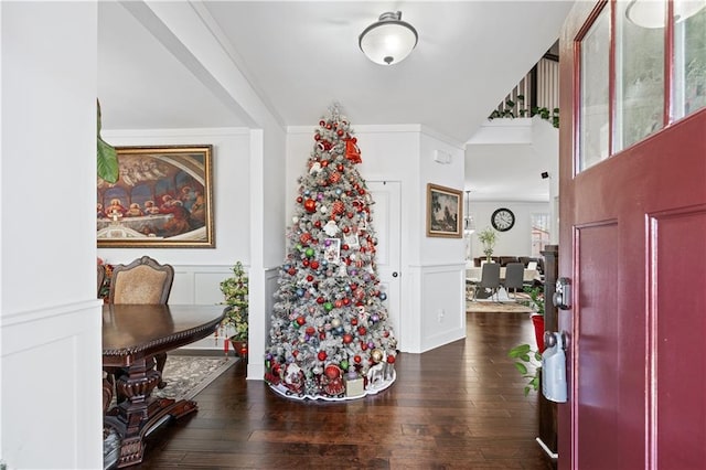 entryway featuring dark hardwood / wood-style floors and ornamental molding