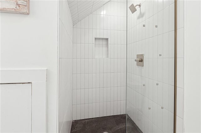 full bathroom with a tile shower