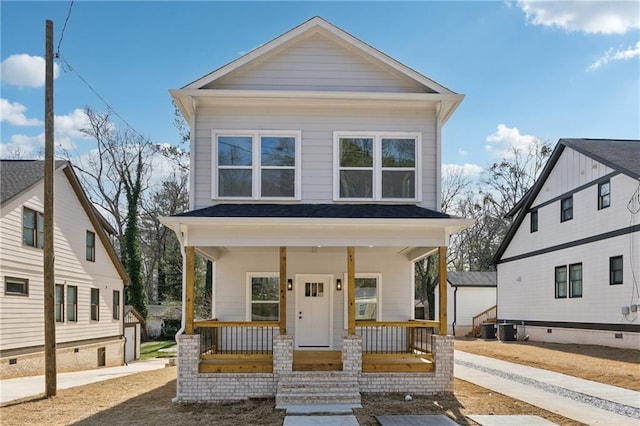 view of front facade with a porch and central air condition unit