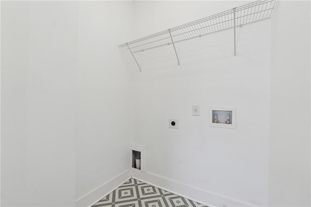 washroom with laundry area, baseboards, tile patterned floors, hookup for a washing machine, and hookup for an electric dryer