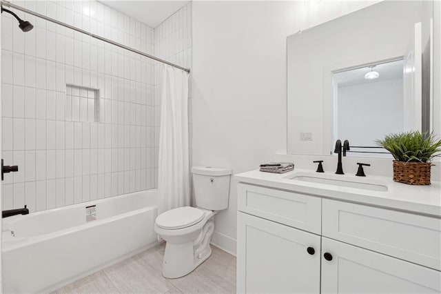 full bathroom featuring shower / bath combo, vanity, and toilet