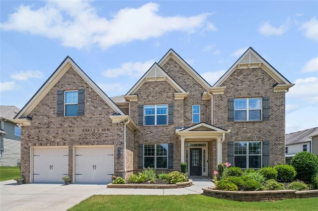 745 Newfield Ln, Alpharetta, GA 30004 - view of front of property featuring brick siding, a garage, and driveway