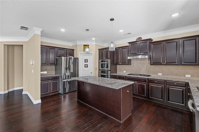 745 Newfield Ln, Alpharetta, GA 30004 - kitchen with appliances with stainless steel finishes, under cabinet range hood, a center island, dark brown cabinetry, and dark wood-type flooring