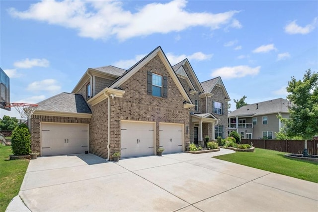745 Newfield Ln, Alpharetta, GA 30004 - view of front facade with brick siding, driveway, and an attached garage