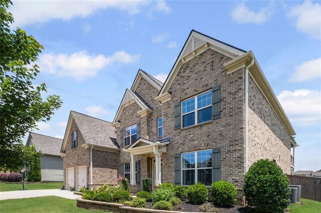 745 Newfield Ln, Alpharetta, GA 30004 - view of front of home with brick siding, a garage, and concrete driveway