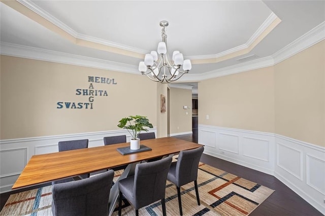 745 Newfield Ln, Alpharetta, GA 30004 - dining area featuring a chandelier, crown molding, a tray ceiling, wood finished floors, and a wainscoted wall