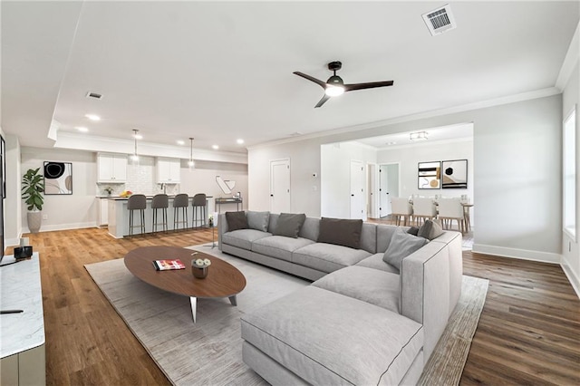 2565 Cork St, Braselton, GA 30517 - living area featuring crown molding, light wood-style floors, a ceiling fan, baseboards, and recessed lighting