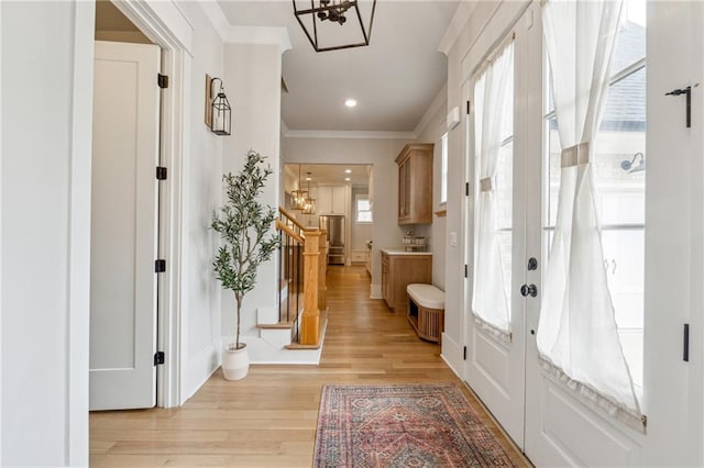 2565 Cork St, Braselton, GA 30517 - entrance foyer featuring stairway, french doors, crown molding, light wood-style flooring, and a chandelier