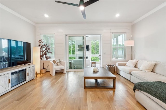 2565 Cork St, Braselton, GA 30517 - living area with crown molding, light wood finished floors, ceiling fan, and recessed lighting