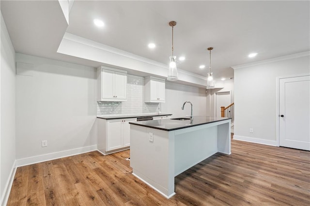 2565 Cork St, Braselton, GA 30517 - kitchen with a sink, decorative backsplash, white cabinets, baseboards, and dark countertops