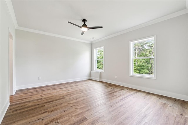 2565 Cork St, Braselton, GA 30517 - spare room with wood finished floors, baseboards, ceiling fan, and ornamental molding