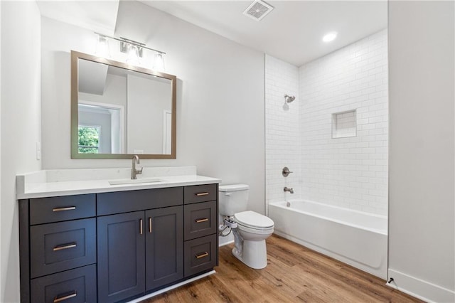 2565 Cork St, Braselton, GA 30517 - bathroom featuring toilet, wood finished floors, vanity, shower / bathtub combination, and baseboards