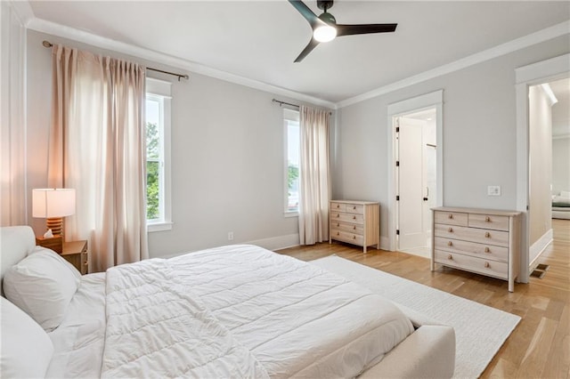 2565 Cork St, Braselton, GA 30517 - bedroom with crown molding, light wood-type flooring, baseboards, and a ceiling fan