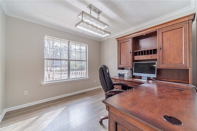 office area featuring crown molding, light hardwood / wood-style flooring, and a textured ceiling