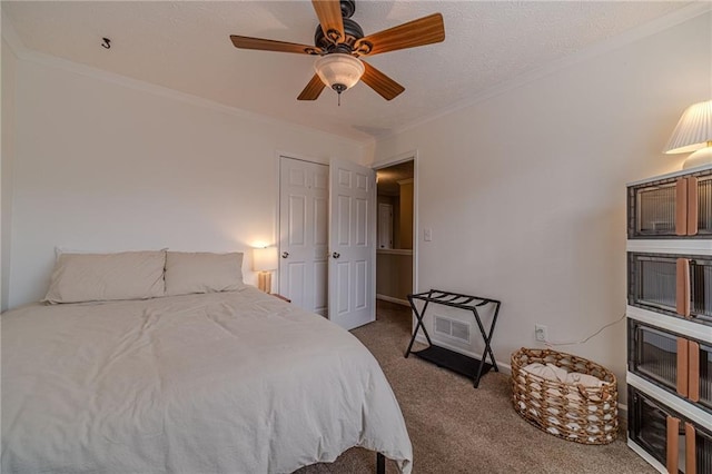 carpeted bedroom featuring crown molding and ceiling fan