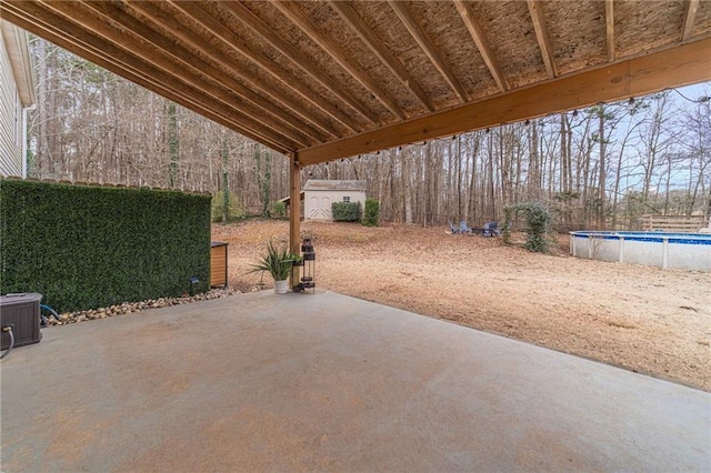 view of patio / terrace with a storage unit