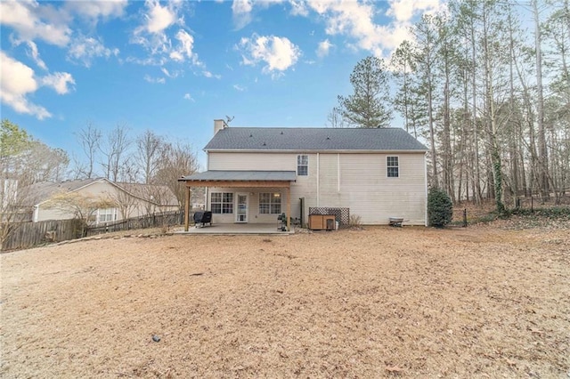 rear view of house featuring a patio