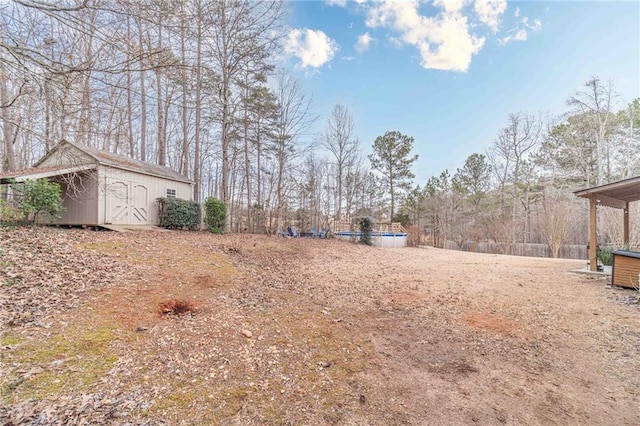 view of yard featuring a storage unit