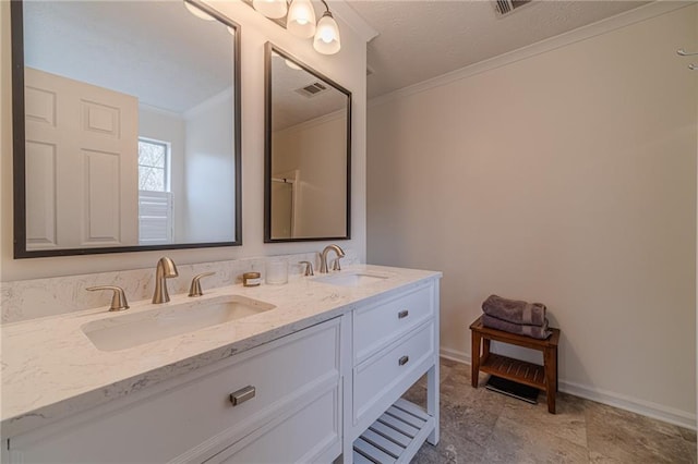 bathroom featuring vanity, a shower with door, and ornamental molding