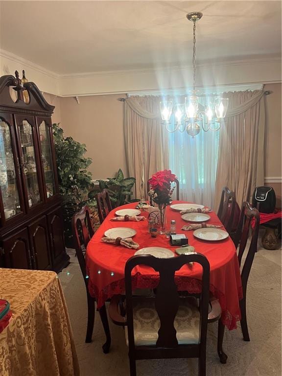 148 River N Blvd, Macon, GA 31211 - carpeted dining area featuring an inviting chandelier and crown molding