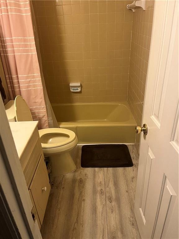 148 River N Blvd, Macon, GA 31211 - full bathroom with shower / tub combo with curtain, wood finished floors, vanity, and toilet