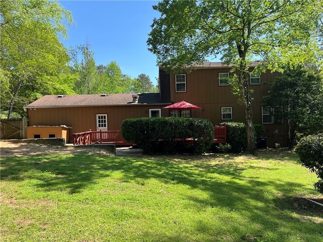 148 River N Blvd, Macon, GA 31211 - rear view of property with a wooden deck, fence, and a yard