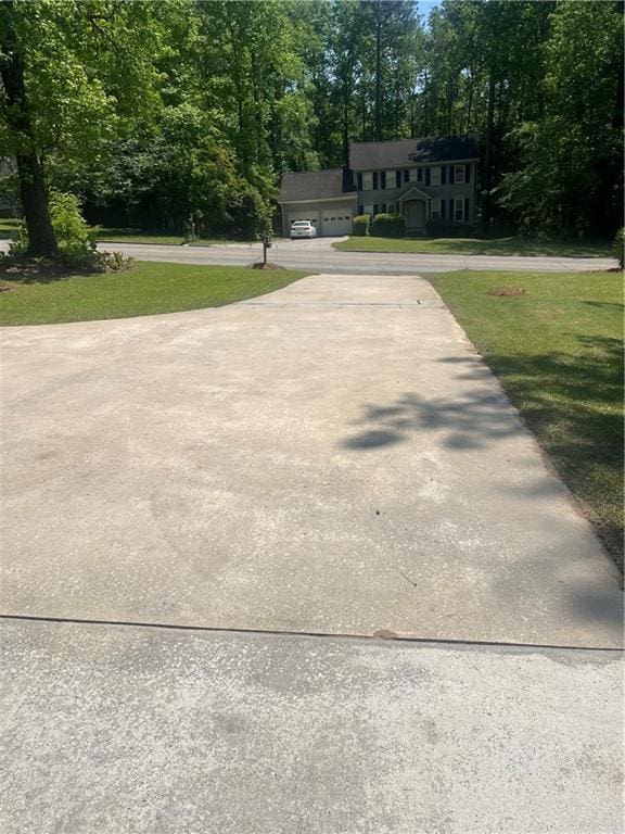 148 River N Blvd, Macon, GA 31211 - view of community featuring a garage, a yard, and driveway