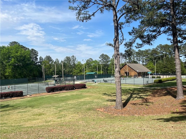 148 River N Blvd, Macon, GA 31211 - surrounding community featuring fence, a lawn, and a tennis court