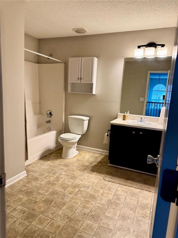 full bathroom with a textured ceiling, vanity, shower / bathtub combination, and toilet