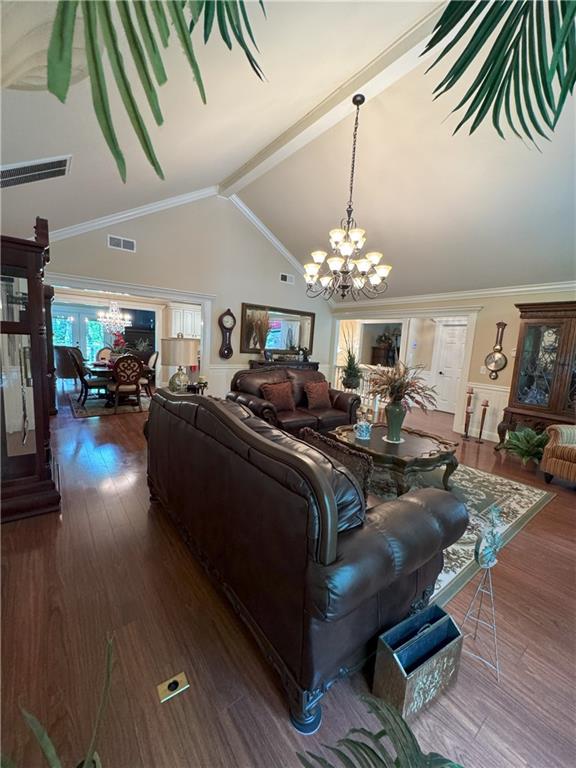 334 Eagle Cir, Dillard, GA 30537 - living area featuring a chandelier, wood finished floors, beam ceiling, and high vaulted ceiling